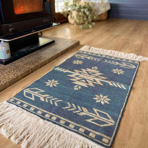 Bring a touch of the Southwest to your living space  These beautiful cotton canvas rugs are the perfect thing to spice up your dining table, sideboards, floors, doorway, anywhere and everywhere. Can be hung as wall art.  Southwest design with grey/blue background. Each rug is handwoven by artisans, stencil printed on cotton canvas with fringe ends.  Size 31.5” - 60x90cm + fringe.  Limited edition. Just a couple of these were made, we think this makes these extra special. 